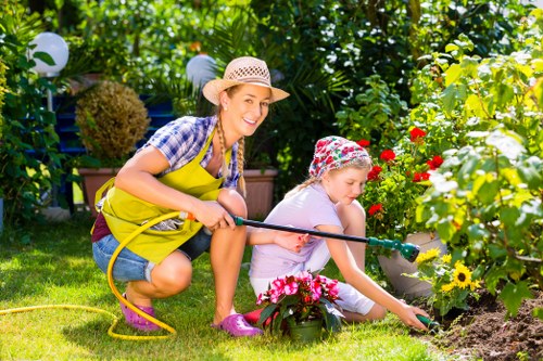 Professional gardeners in Ickenham maintaining safe work practices